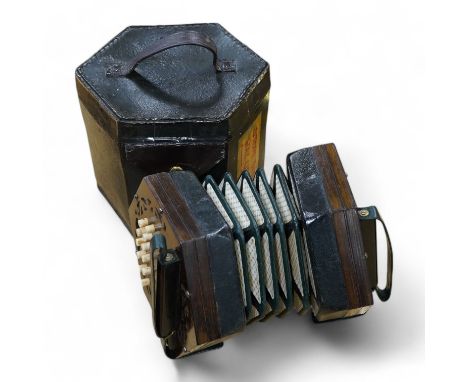 A leather cased mid 19th century Lachenal, London, 23 button concertina. Condition - fair to good, some wear to the case, the