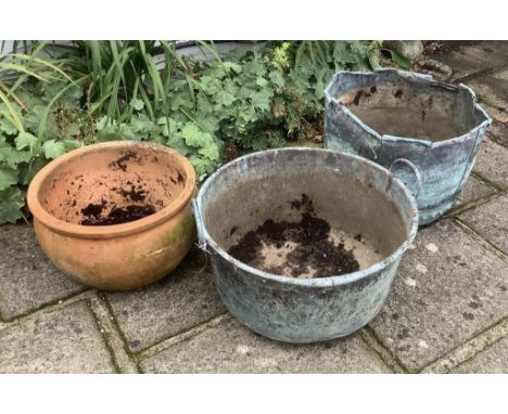 Two copper planters and one terracotta planter, planting removed, largest height 46cm. Condition - all weathered, copper copp