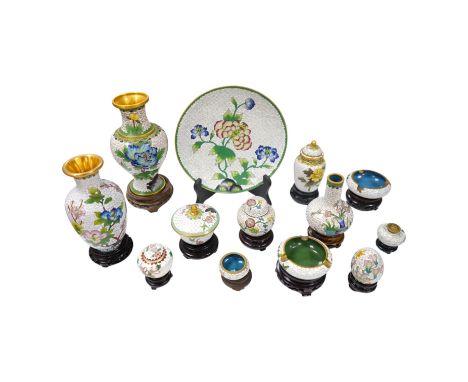 A collection of Chinese cloisonné enamel vases, pots etc., all worked on a white background in floral designs, plate, 20cm di