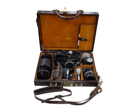 A cased Olympus camera, lenses and equipment, Condition - poor