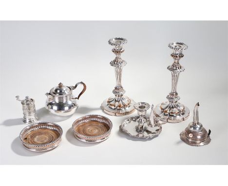 Silver plated wares, to include a pair of Sheffield plate candlesticks, a pair of Sheffield plate coasters, a pepper mill, an