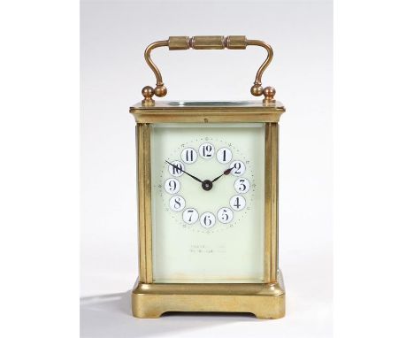 Early 20th Century gilt brass carriage clock, the five glass case with a pale green enamel dial with raised hour numeral and 