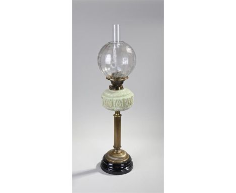 Victorian oil lamp, the foliate etched glass shade above a vaseline glass reservoir and fluted column, 77cm high