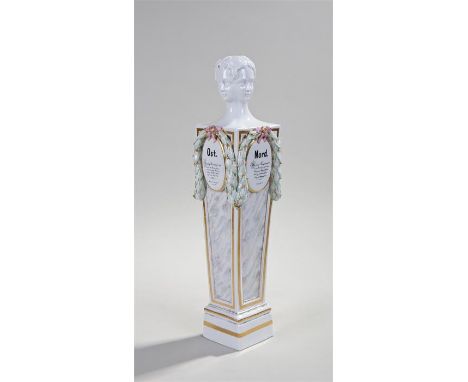 Meissen porcelain column, the column surmounted by a four portrait head above ribbon tied leaf decoration and the points of t