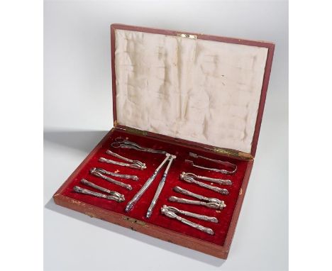 Impressive Victorian cased nut cracker set, with six nut crackers, a larger pair, grape scissors and tongs, housed within a l