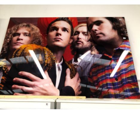 •DEAN CHALKLEY. ARR. THE KILLERS, COLOUR PHOTOGRAPHIC PRINT. ENCASED IN PERSPEX WITH METAL FRAME ON REVERSE. 172 x 115cms.