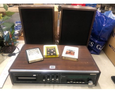 AN AMEREX AC 8 TRACK STERO PLAYER - ACR306 WITH SPEAKERS AND A FEW 8 TRACK CARTRIDGES INCLUDING STATUS QUO, THE HOLLIES, THE 