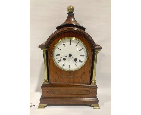 An early 20th century satinwood and inlaid mantle clock with French brass drum movement striking on a bell. 14' high