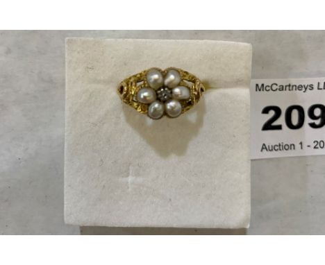 An antique old cut diamond and split pearl cluster ring. Apparently in gold but unmarked. 3g gross. Size N