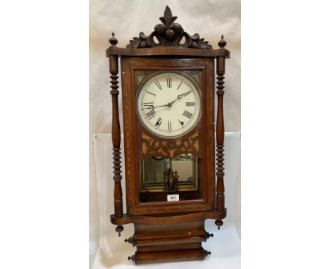 A walnut inlaid American wall clock 35' high