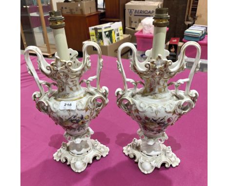 A pair of ceramic table lamps, painted with summer flowers in coloured enamels. 14' high excluding fittings (Gilding worn, re