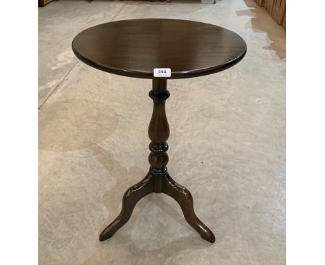 An Ercol tripod table. 30' high