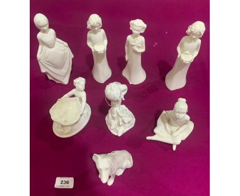 A collection of Royal Worcester and other white glazed figures