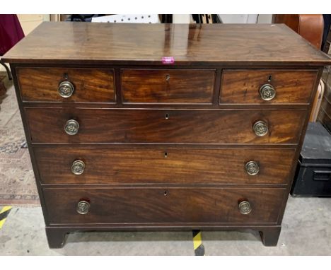 A Regency mahogany chest, the crossbanded line inlaid top over three short and three long drawers, raised on bracket feet. 43