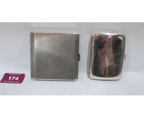 A George V engine turned silver cigarette case, the interior engraved, Birmingham 1928; together with another silver cigarett