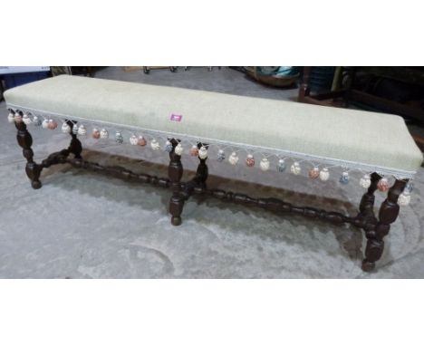 A 19th century turned oak long stool. 60' long