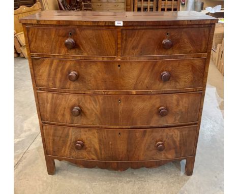 A 19th century mahogany bowfronted chest of two short over three long drawers raised on bracket feet