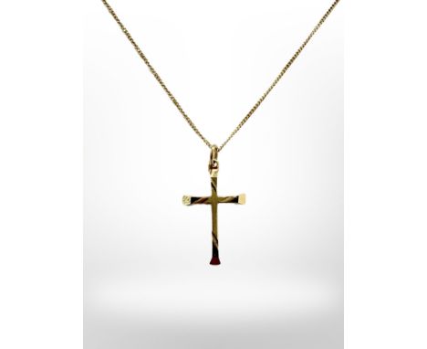 A 9ct yellow gold necklace with yellow metal crucifix pendant. CONDITION REPORT: Chain knotted, gross weight 1.3g.