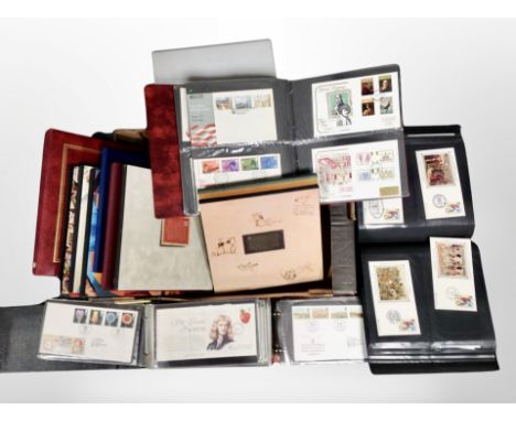 A box of several albums of first day covers, Royal Mail special stamp collections etc 