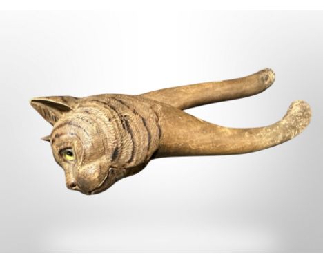 A carved wooden nut cracker in the form of a cat, length 22 cm