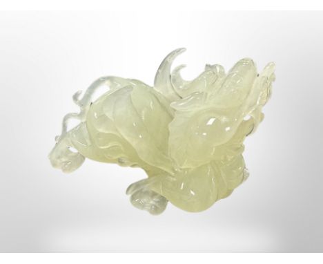 A carved jade Dragon, height 9 cm, length 12 cm. 