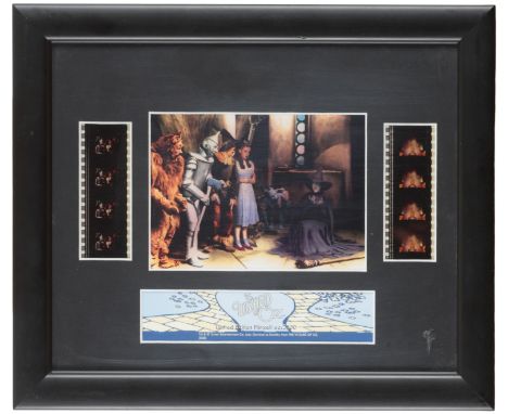 THE WIZARD OF OZ: A LIMITED EDITION FILM CELL composed of central colour print and two strips of film, 20cm x 24cm, 66 of 250