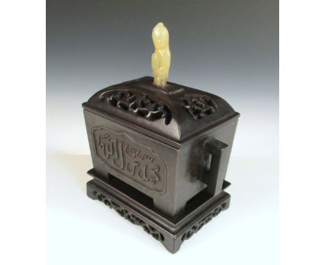 A bronze incense burner with zitan stand and jade mounted cover, the longer sides of the two handled rectangular body with Is