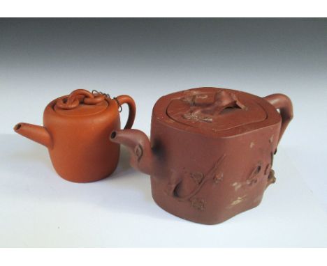 Two Yixing tea pots and covers, the smaller of rounded cylindrical shape, the cover with two loose rings moveable about the r