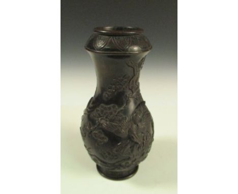 A late 19th/early 20th century bronze vase, a lappet band on the rounded shoulders of the baluster shape cast with an eagle b