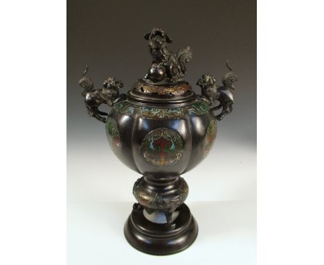 An early 20th century champleve bronze censer and cover, Buddhist lion handles on the shoulders of the melon shaped body work