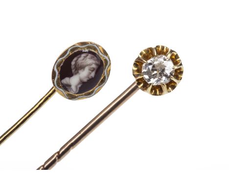 DIAMOND SET PIN, set with an old cushion cut diamond of approximately 0.15 carats, unmarked, along with another mounted with 