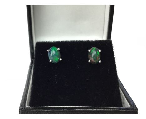 PAIR OF BLACK OPAL EARRINGS, each set with a cabochon opal 7mm long, each marked 925 to the posts, 1.3g