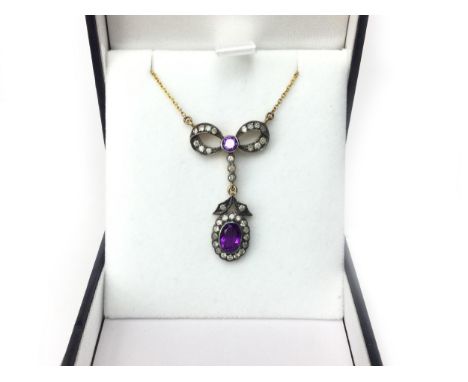 AMETHYST AND DIAMOND PENDANT, with an amethyst and diamond cluster suspended from a diamond set bow, the diamonds totalling a
