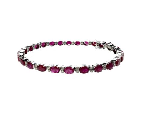 RUBY AND DIAMOND BRACELET, set with oval faceted rubies each approximately 4.5mm long and interspaced by pairs of diamonds, m