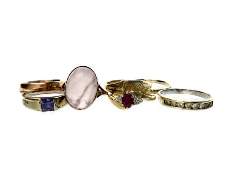 SEVEN DRESS RINGS, mostly in nine carat gold, including an eighteen carat gold red gem and diamond example, size K, 2.7g and 