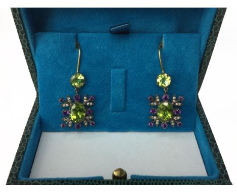 PAIR OF AMETHYST, PERIDOT AND DIAMOND EARRINGS, each section set with an oval peridot flanked by round amethysts and round br