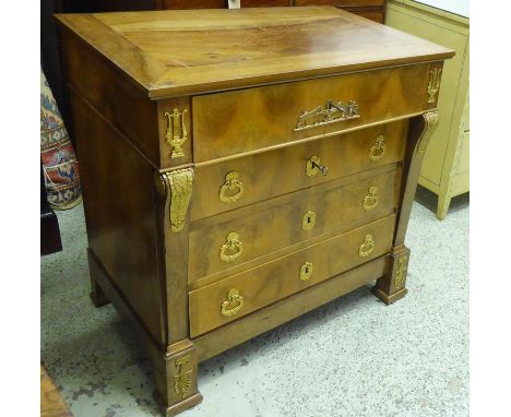 SECRETAIRE COMMODE, Charles X walnut with a part fitted drawer enclosing a black leather and gilt tooled lined interior above