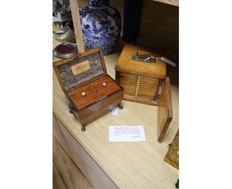 A Regency rosewood tea caddy, width 20cm and a Victorian pine slide cabinet (empty)