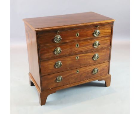 A George III mahogany chest with brushing slide and four graduated long drawers. on bracket feet W.2ft 10in. D.1ft 7in. H.2ft