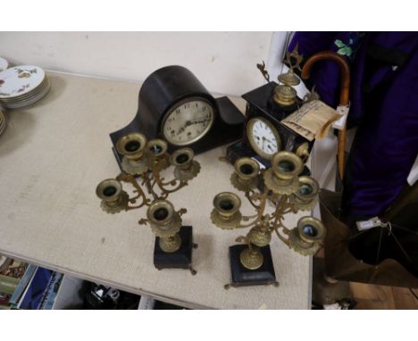 A Victorian black slate clock garniture and a mantel clock