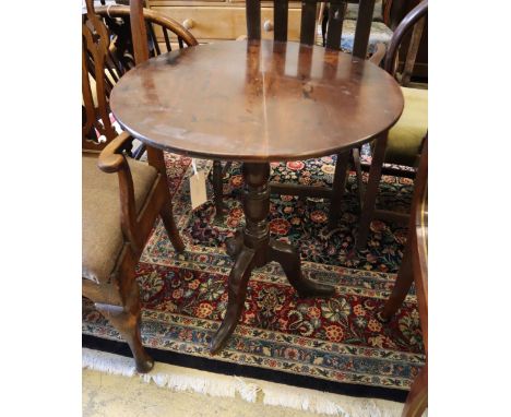 A mahogany tripod table with circular top, width 64cm, depth 65cm, height 75.5cm