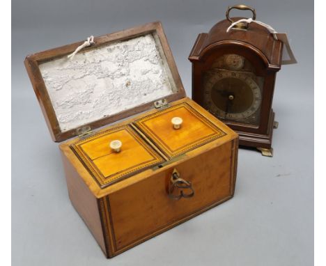 A George III satinwood tea caddy, width 19cm, and a mahogany mantel clock