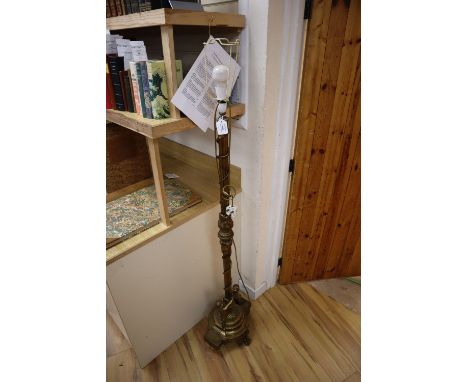 An ormolu putti decorated standard lamp