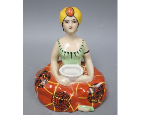 Henri Delcourt, Boulogne-Sur-Mer. A porcelain inkwell modelled as a figure of a genie, height 16cm