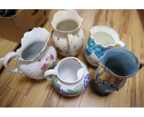 A Carltonware jug and four other ceramic jugs, tallest 31cm
