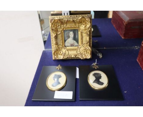 A 19th Century English School miniature portrait of a young lady in ornate gilt frame and two silhouette portraits (3)
