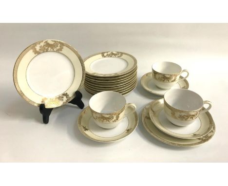 NORITAKE PART TEA SETwith cream coloured and gilt border decoration, comprising seven cups, twelve saucers and twelve side pl