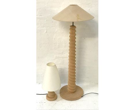 BARLEY TWIST LIGHT OAK STANDARD raised on a circular base with a tapering column and a manila card shade, 137cm high; togethe