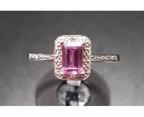 PINK GEM SET AND DIAMOND RINGthe central emerald cut pink gemstone with small diamonds above, below and to the shoulders, on 