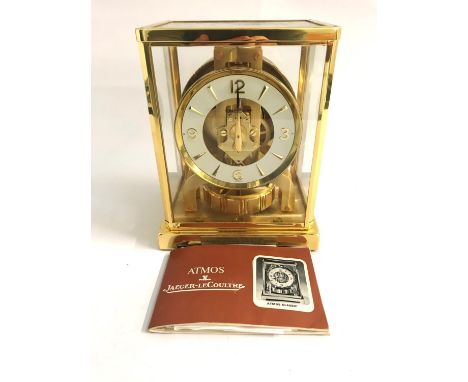 JAEGER-LECOULTRE 'ATMOS' CLOCKthe gilt brass case with five glazed panels and a white circular dial, with dagger and Arabic n